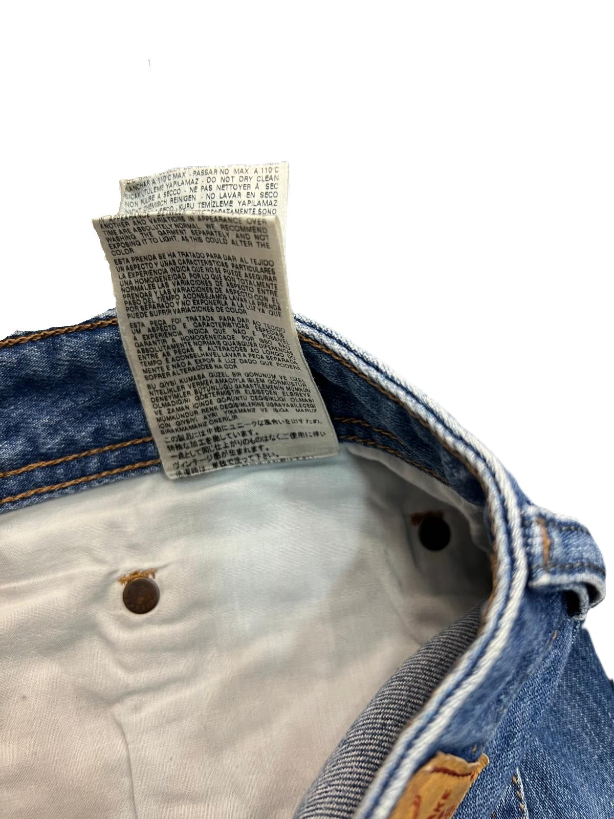 Jeans Diesel Industry uomo taglio Regular Straight in denim blu con lavaggio medio e dettaglio etichetta 