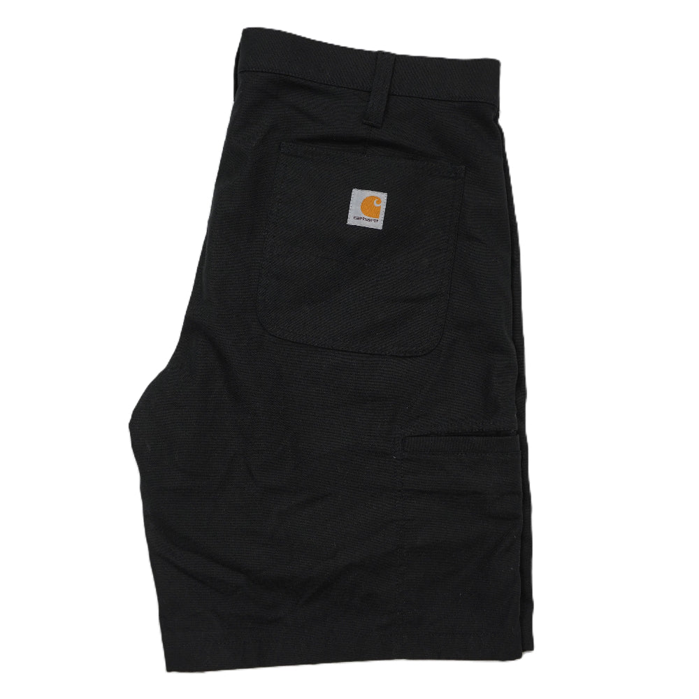 Bermuda Carhartt WIP neri in tessuto resistente Rugged Flex piegati di tre quarti con etichetta quadrata sul retro