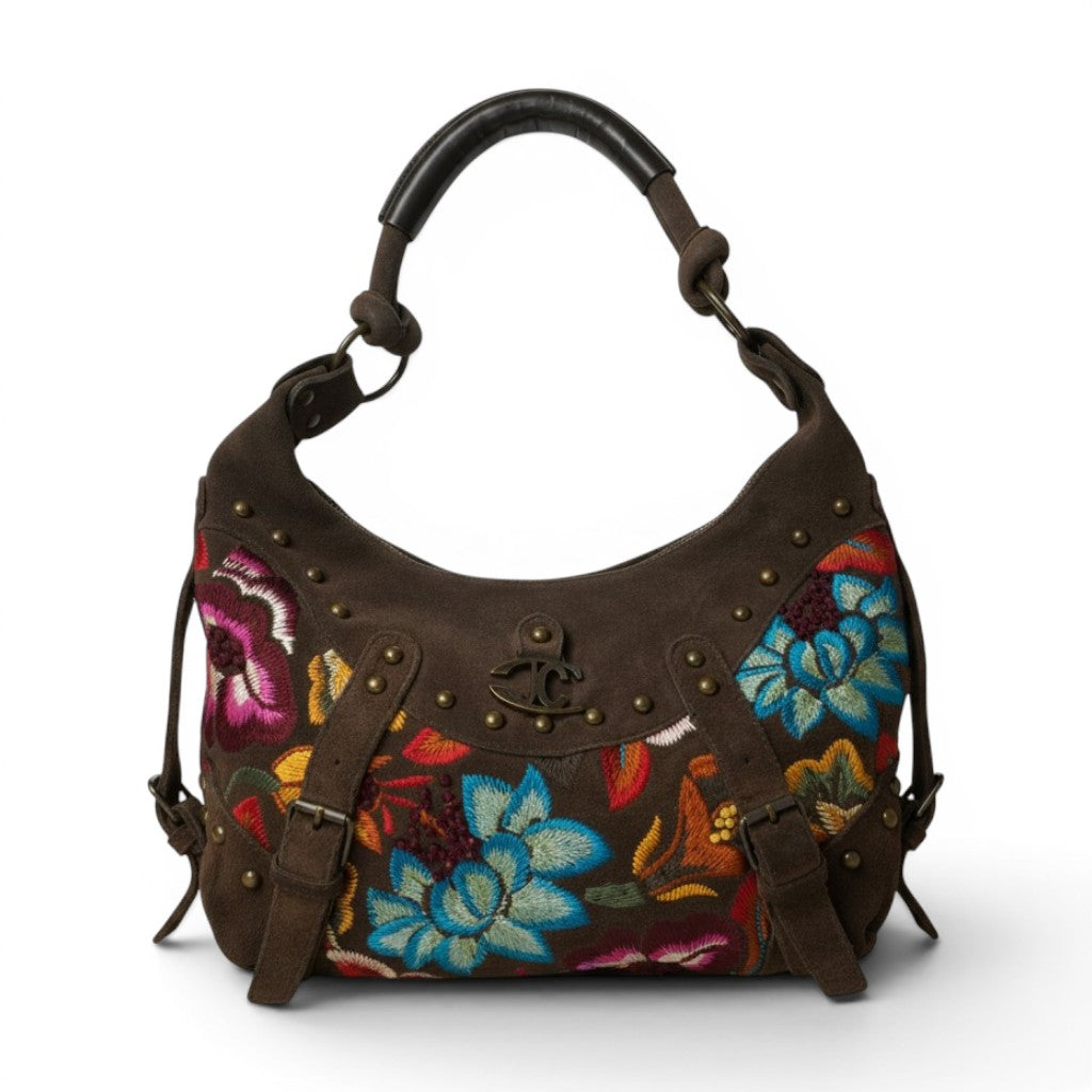 Vista frontale completa della borsa hobo vintage Just Cavalli in pelle scamosciata marrone con fitti ricami floreali multicolor e borchie.