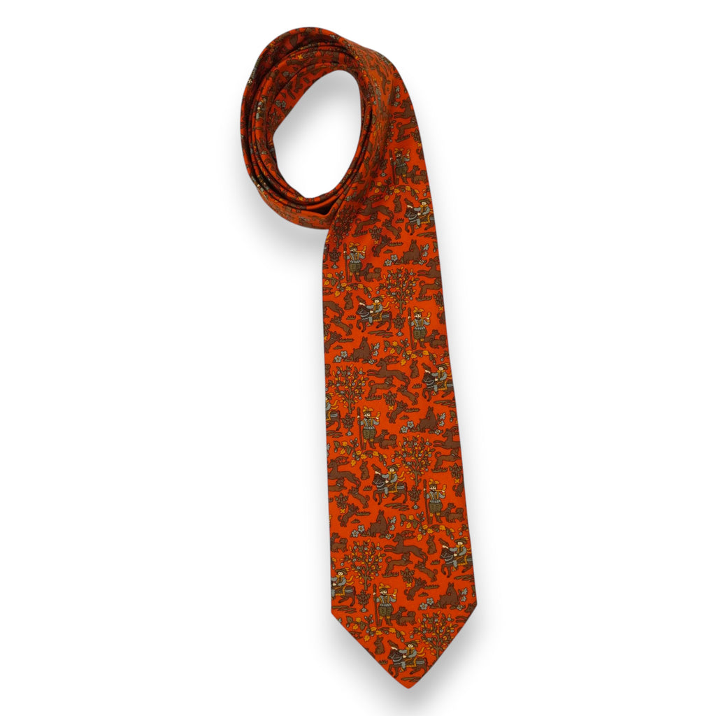 Cravatta vintage Etro Milano in pura seta arancione con motivo a stampa medievale su sfondo bianco.