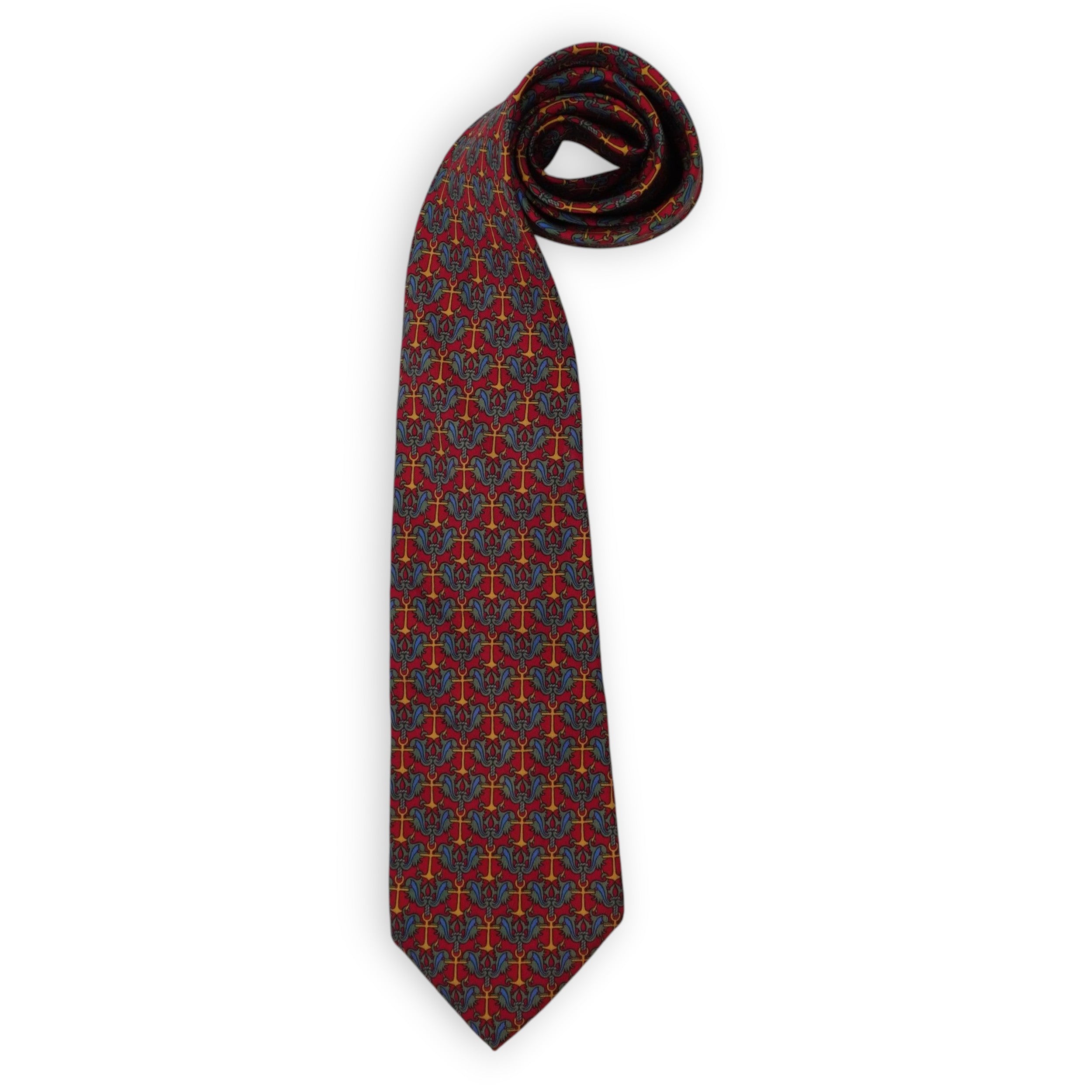 Cravatta vintage Hermès Paris originale modello 7255 MA in pura seta rossa con micro pattern geometrico ad ancore marine su sfondo bianco.