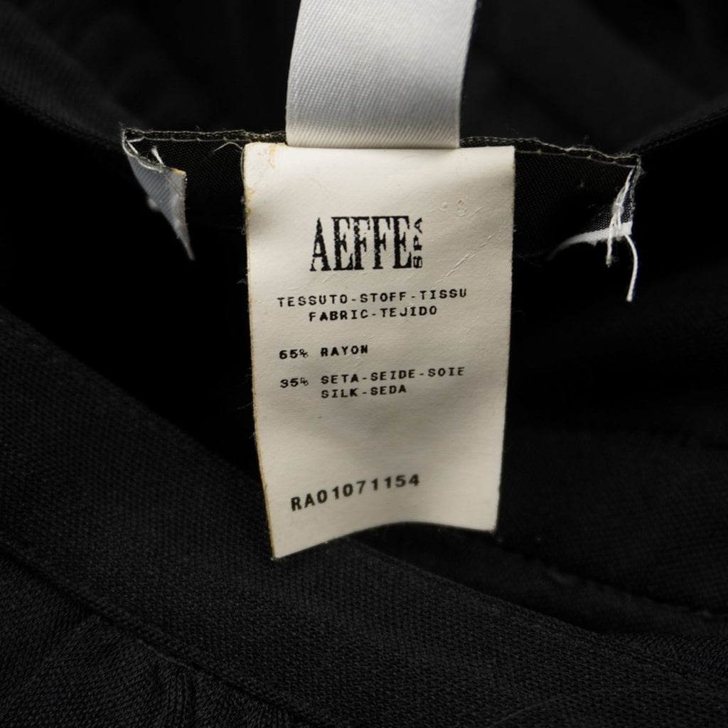 Etichetta di autenticità AEFFE S.p.A. con composizione tessuto 65% rayon e 35% seta.
