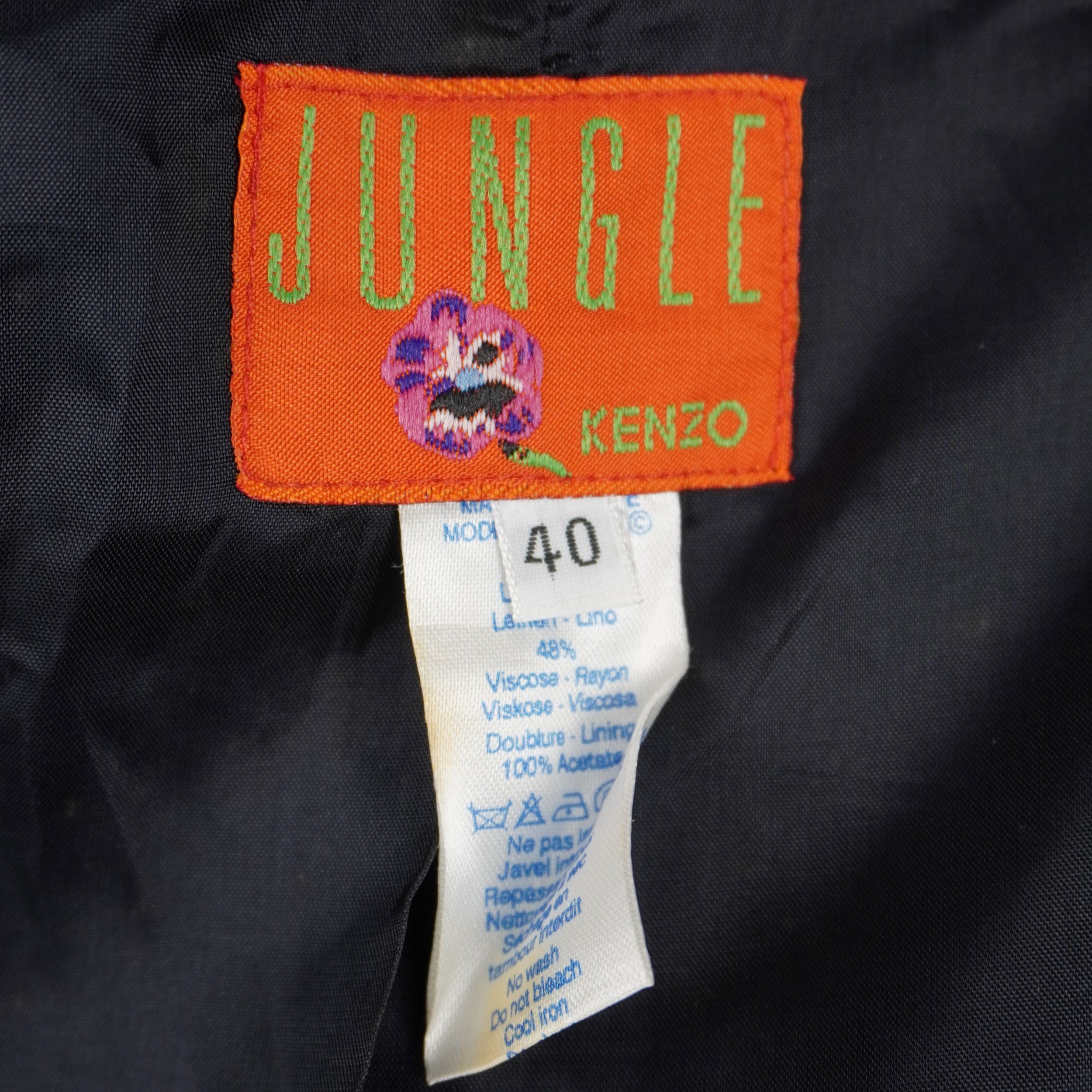 Etichetta arancione originale Kenzo Jungle taglia 40 con indicazione dei materiali e simboli di lavaggio.