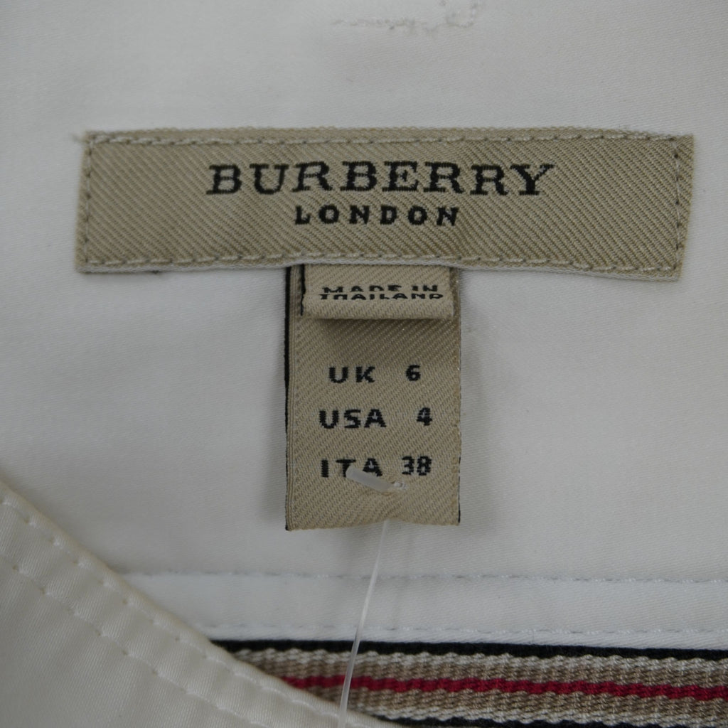 Etichetta originale Burberry London cucita all'interno della vita con l'indicazione della taglia italiana 38.