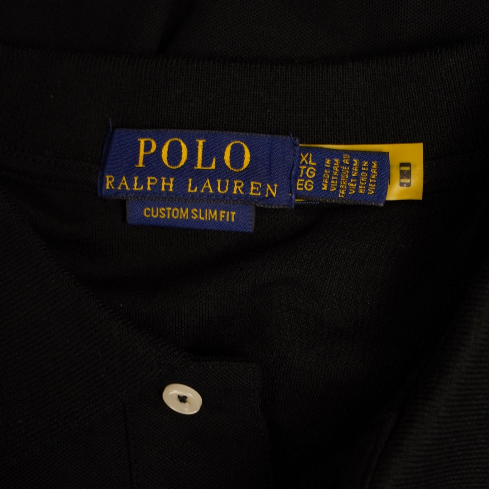 Etichetta blu originale interna al colletto Polo Ralph Lauren che indica la taglia XL.