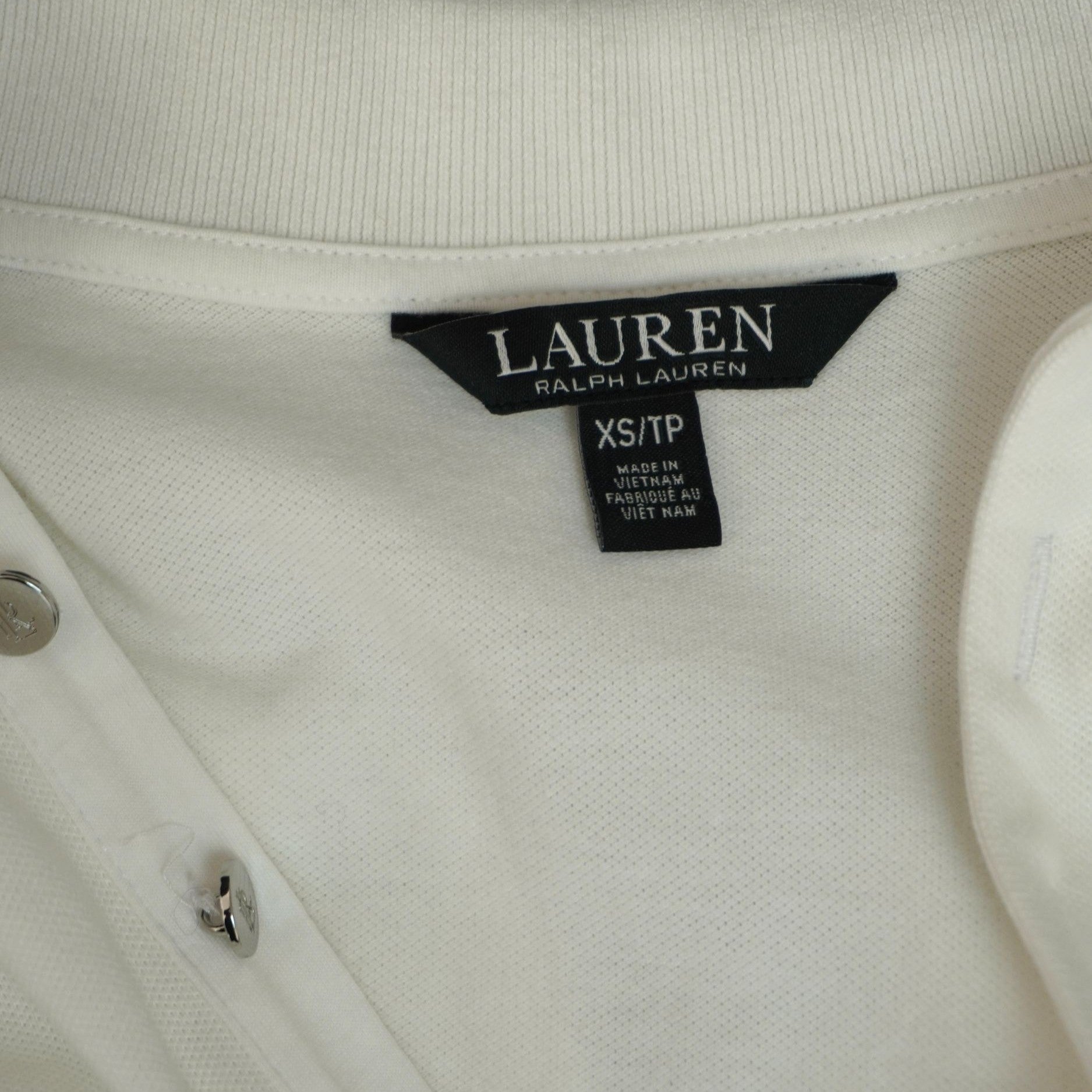 Etichetta originale interna di colore nero Polo Ralph Lauren cucita sul retro del collo con indicazione della taglia XS.