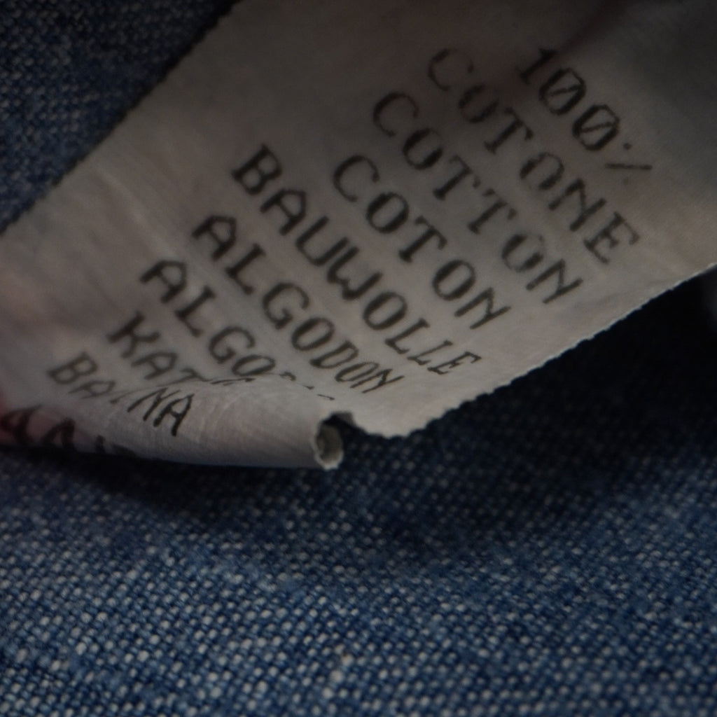  Tag interno multilingue che attesta la composizione tessile in 100% cotone della gonna jeans vintage Extyn.