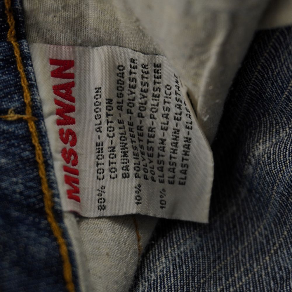  Etichetta di composizione interna della gonna MISSWAN che certifica il tessuto stretch: 80% cotone, 10% poliestere, 10% elastam.