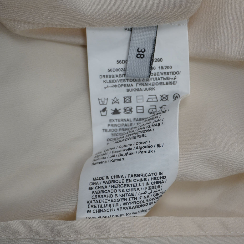 Etichetta di lavaggio interna Trussardi Jeans con composizione in cotone, codice modello e taglia 38