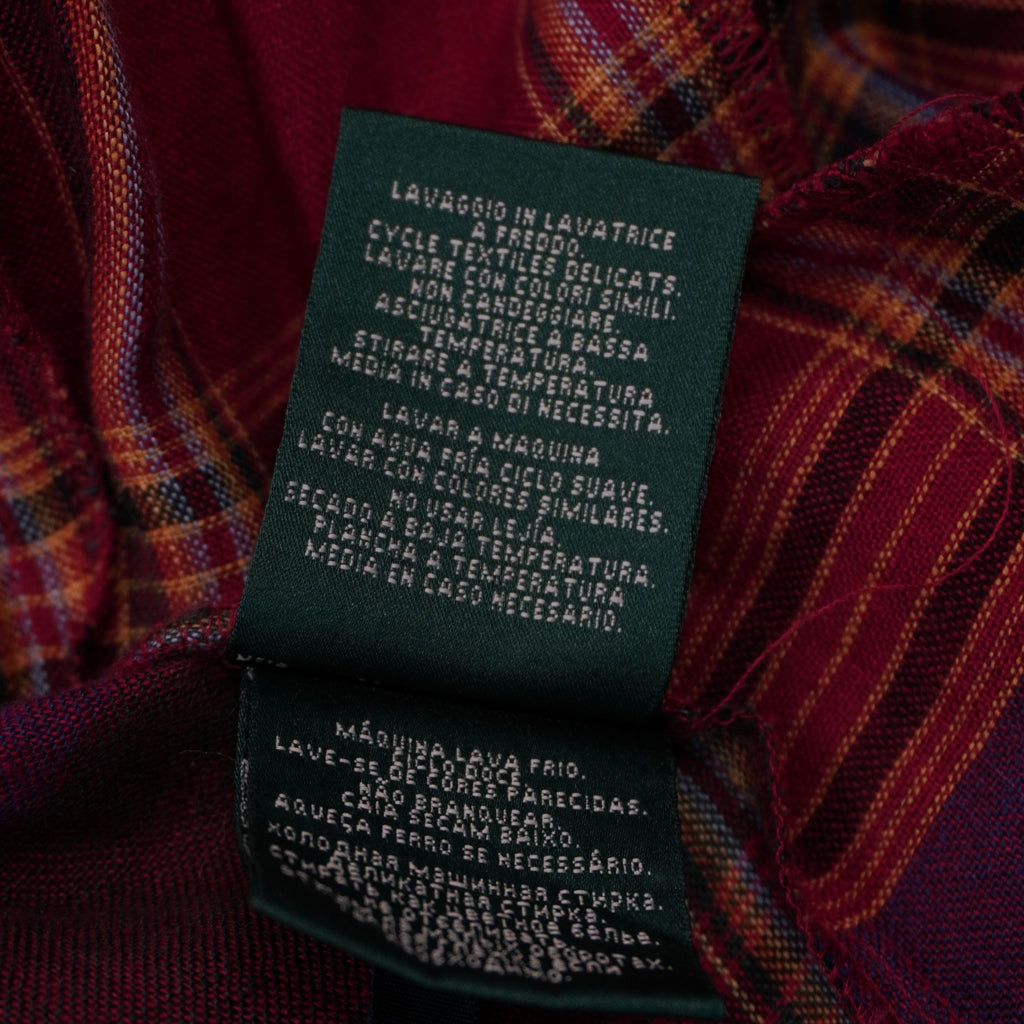 Etichetta interna verde Lauren Ralph Lauren con istruzioni di lavaggio e manutenzione scritte in lingua italiana.