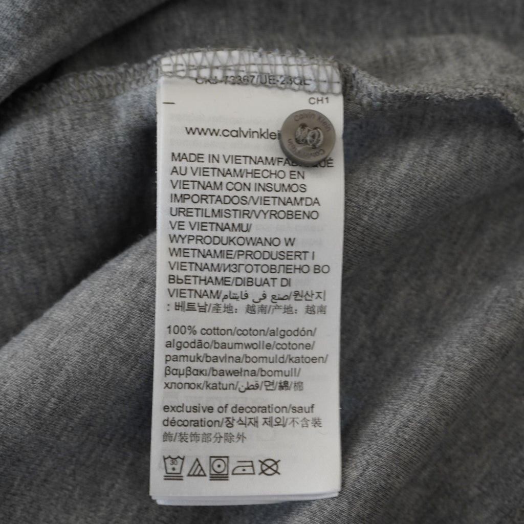 Etichetta interna di lavaggio Calvin Klein 100% cotone Made in Vietnam con ologramma circolare di autenticità