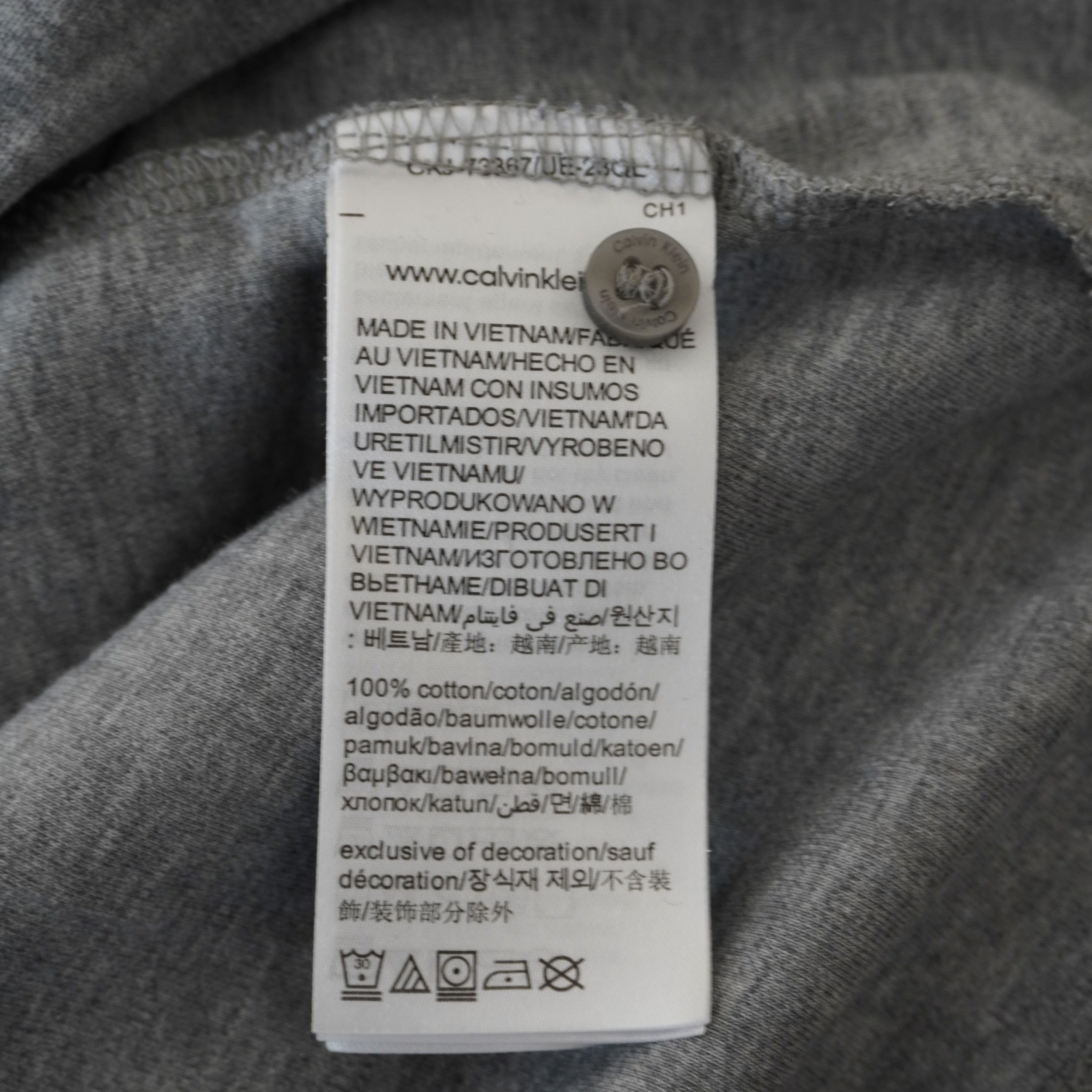 Etichetta interna di lavaggio Calvin Klein 100% cotone Made in Vietnam con ologramma circolare di autenticità