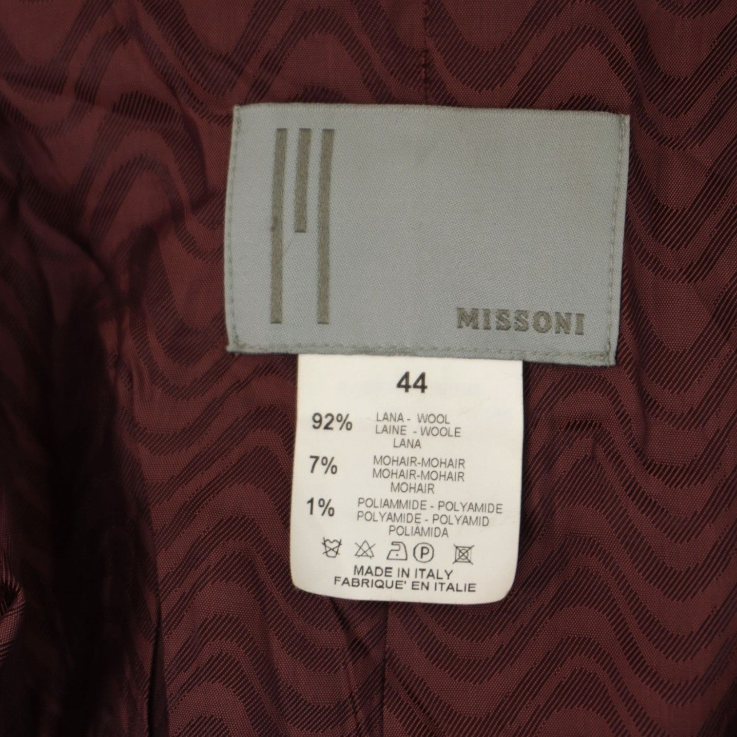 Etichetta originale in tessuto grigio Missoni cucita all'interno della giacca con indicazione della taglia 44 IT.