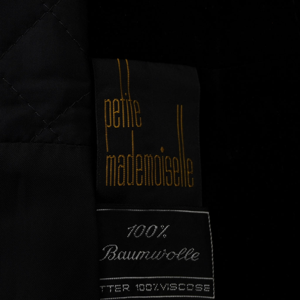 Etichetta originale interna "Petite Mademoiselle" con dettagli dorati, garanzia di autenticità vintage.