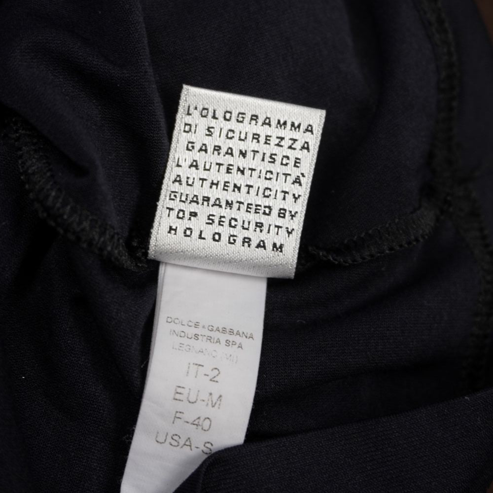 Etichetta di lavaggio Dolce & Gabbana Industria SPA Legnano con dicitura sulla sicurezza dell'ologramma e indicazione taglia IT-2, EU-M, F-40, USA-S.
