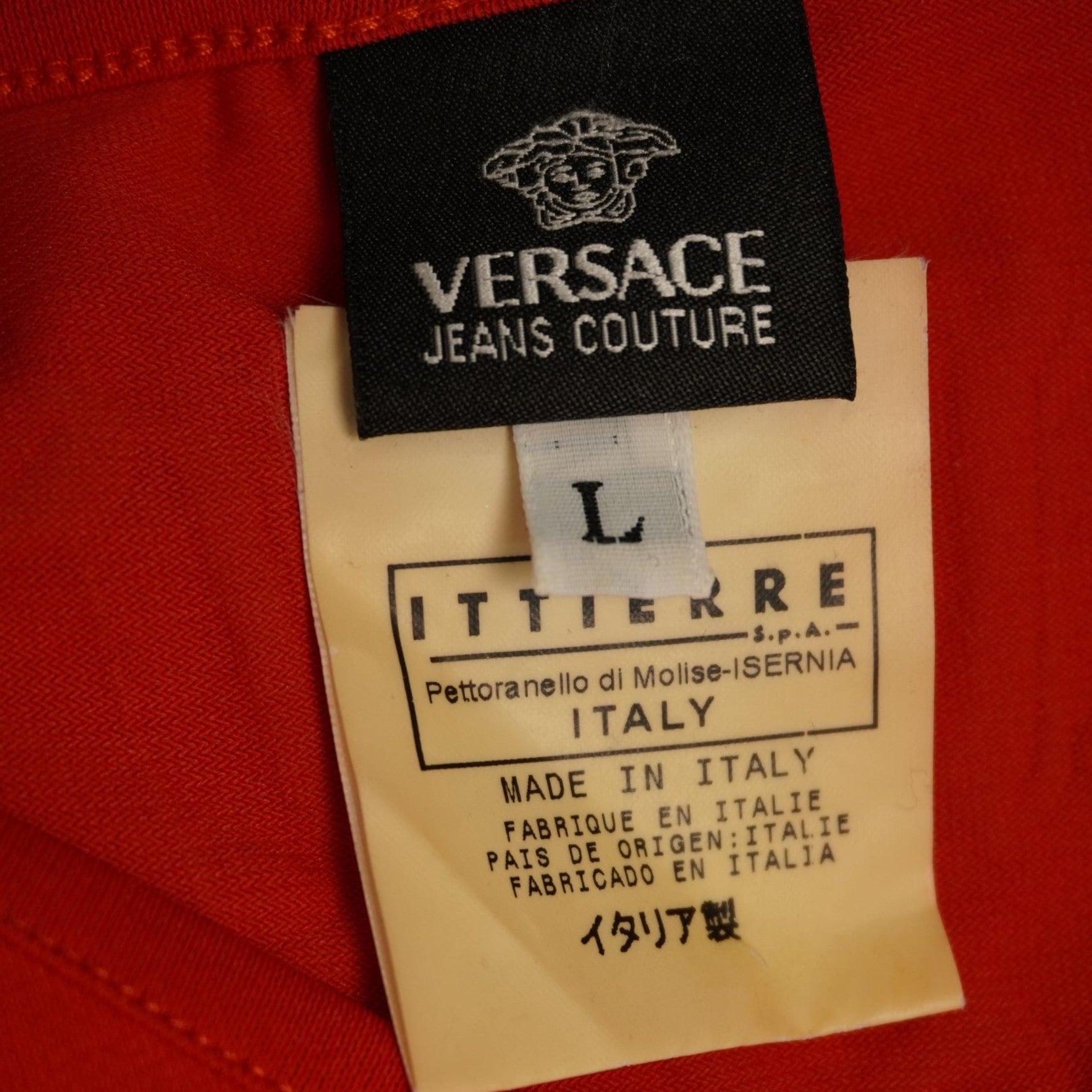 Etichetta originale interna Versace Jeans Couture con taglia L e codice di produzione Ittierre S.p.A.