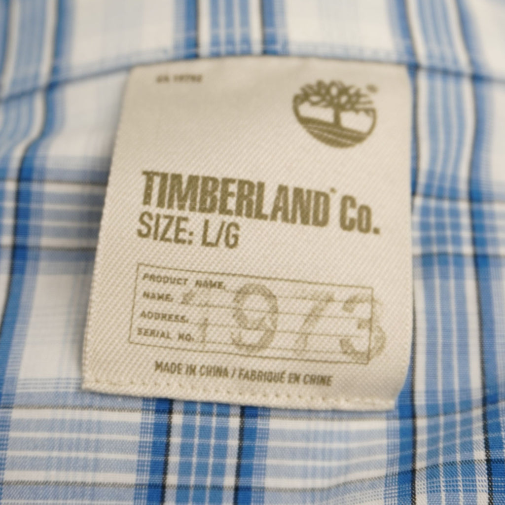 Etichetta interna Timberland Co. "Authentic Heritage" cucita sul colletto della camicia vintage.