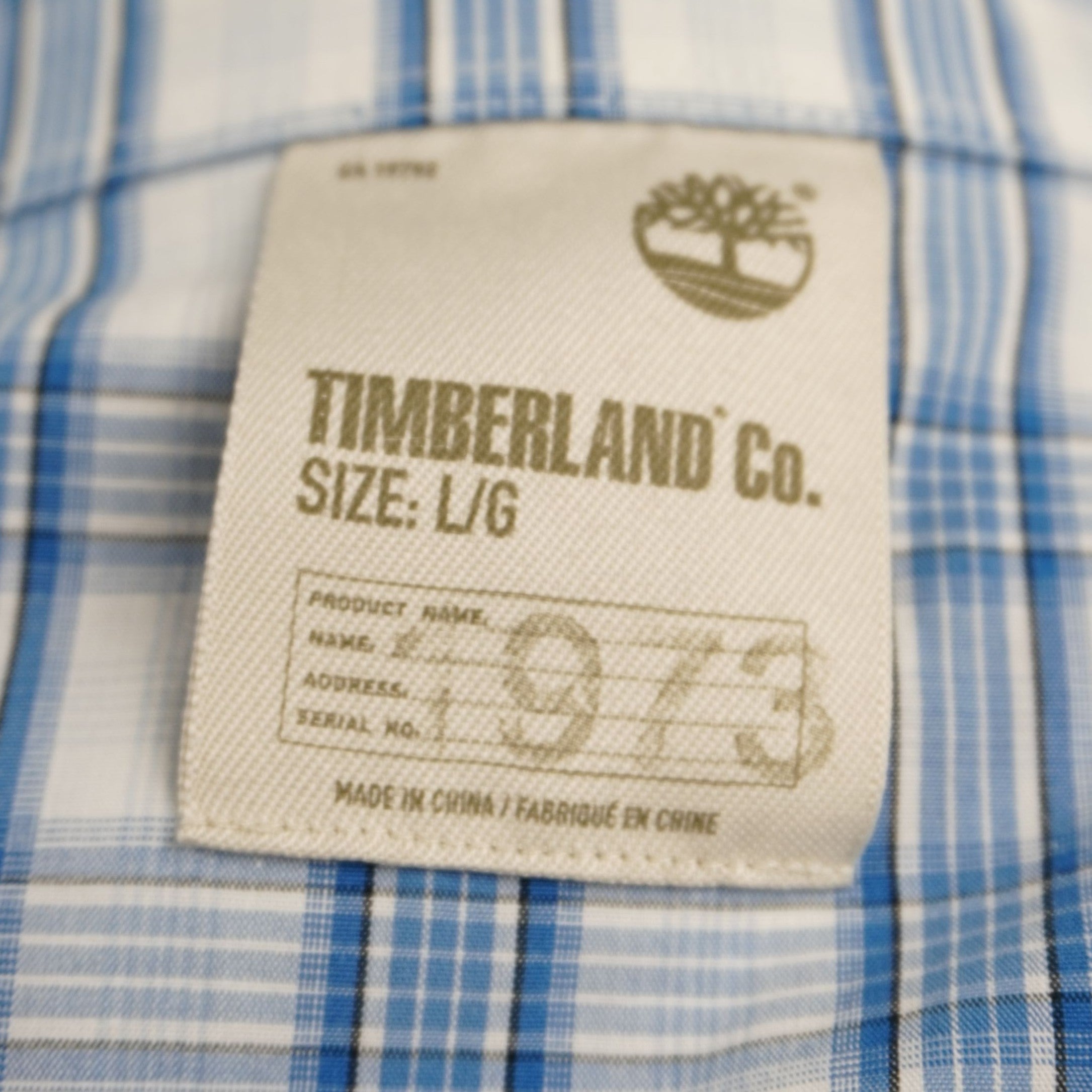 Etichetta interna Timberland Co. "Authentic Heritage" cucita sul colletto della camicia vintage.