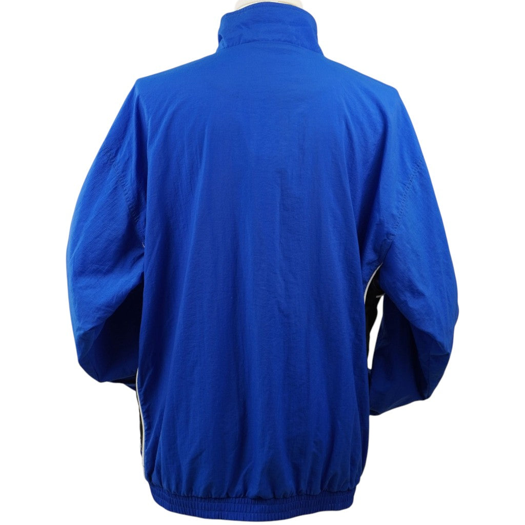 Vista posteriore intera a tinta unita blu della giacca sportiva vintage Puma.
