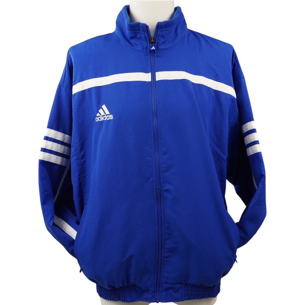 Giacca della tuta adidas vintage in colore blu con dettagli bianchi, vista frontale completa su manichino.