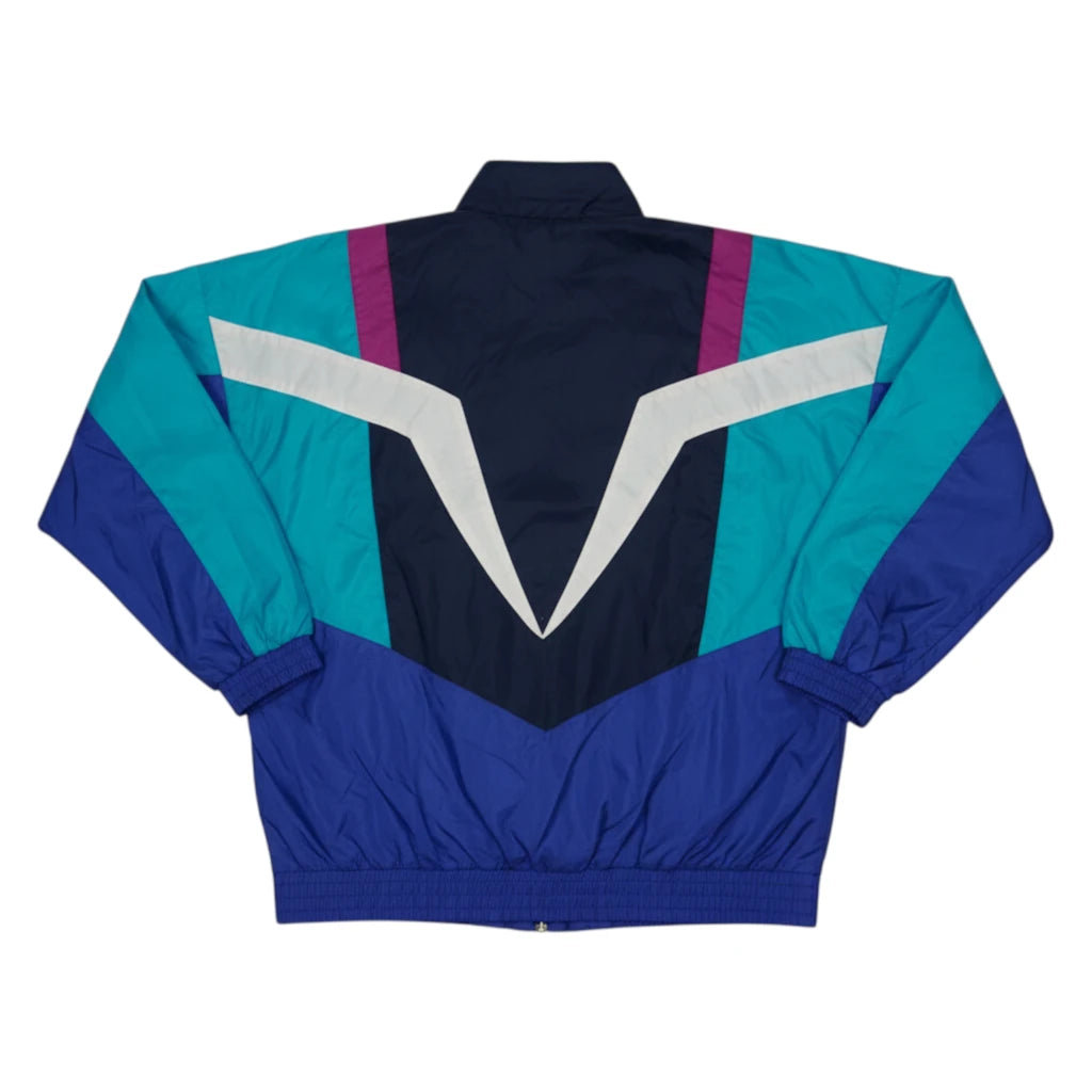 Vista posteriore della giacca sportiva Adidas vintage anni 90 colorblock con motivi geometrici