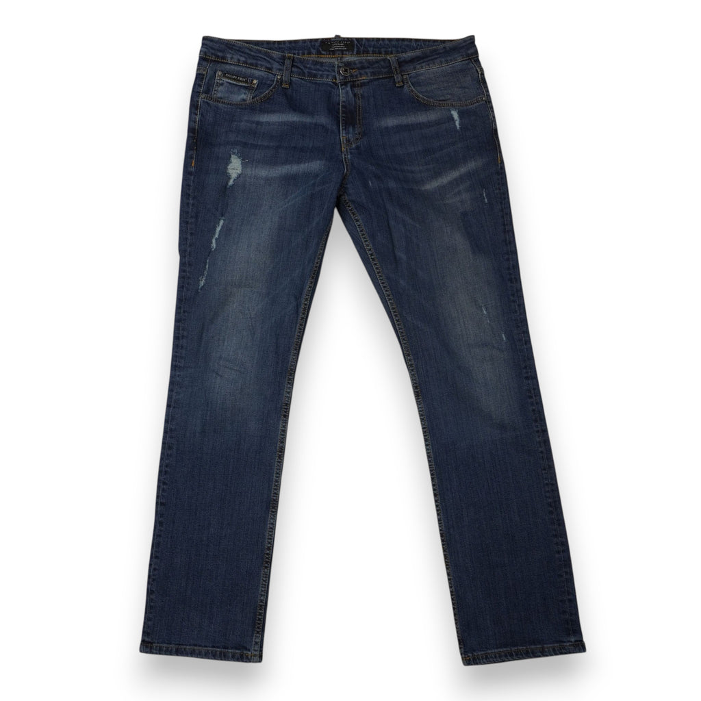 Vista frontale completa dei jeans da uomo slim straight Philipp Plein Couture blu denim con strappi