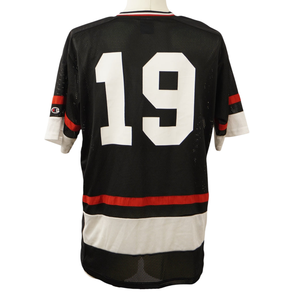  Vista posteriore della jersey da hockey Champion nera con il numero 19 stampato in bianco e bande orizzontali.