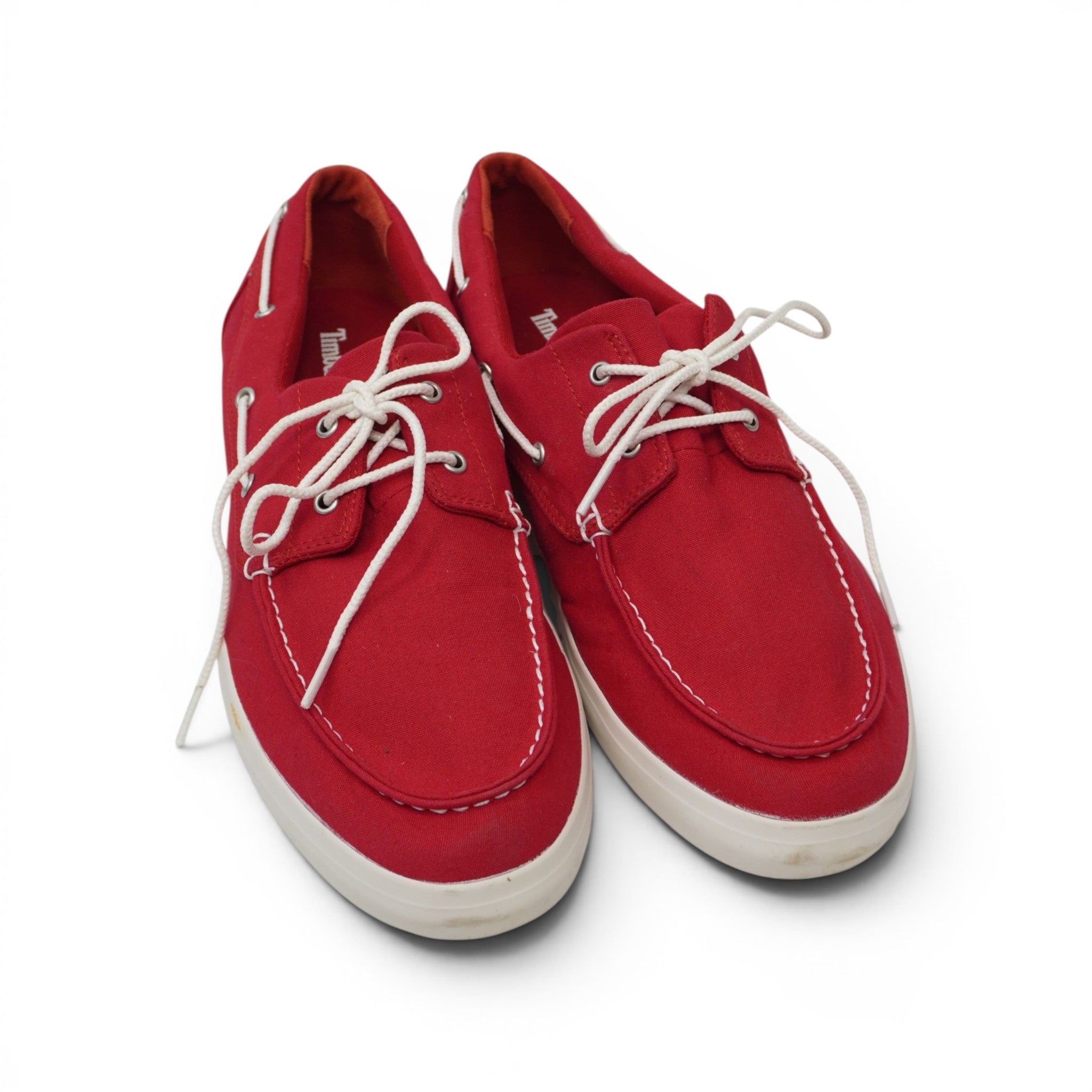 Scarpe da barca uomo Timberland Union Wharf in tela rossa con lacci bianchi su sfondo bianco.