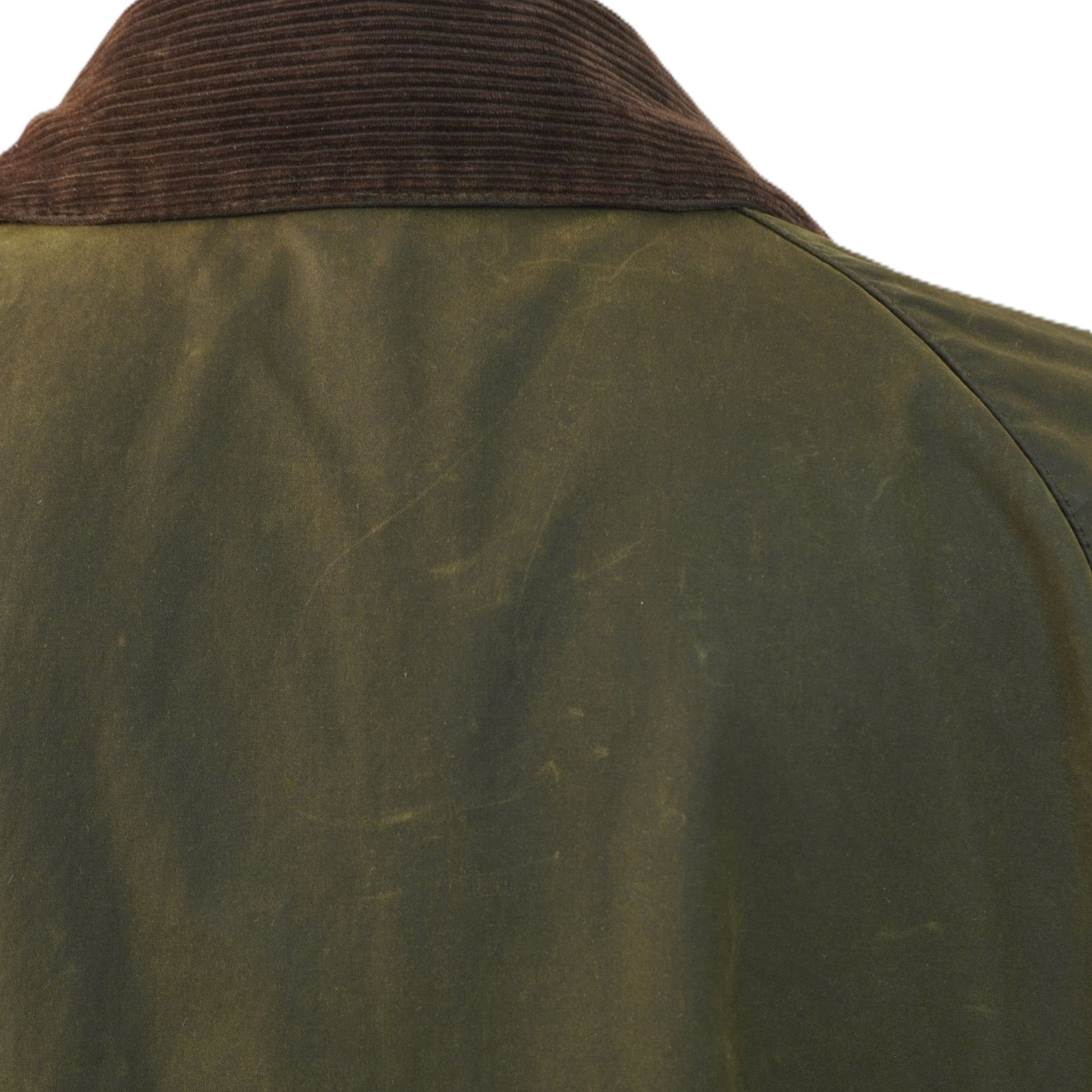 Primo piano del tessuto in cotone cerato verde della giacca Barbour Beaufort vintage in ottime condizioni.